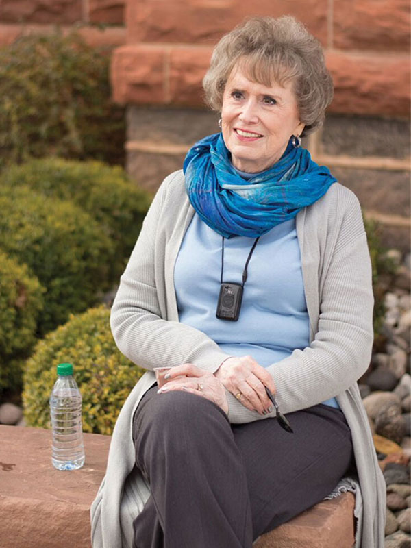 Woman wearing medical alert pendant